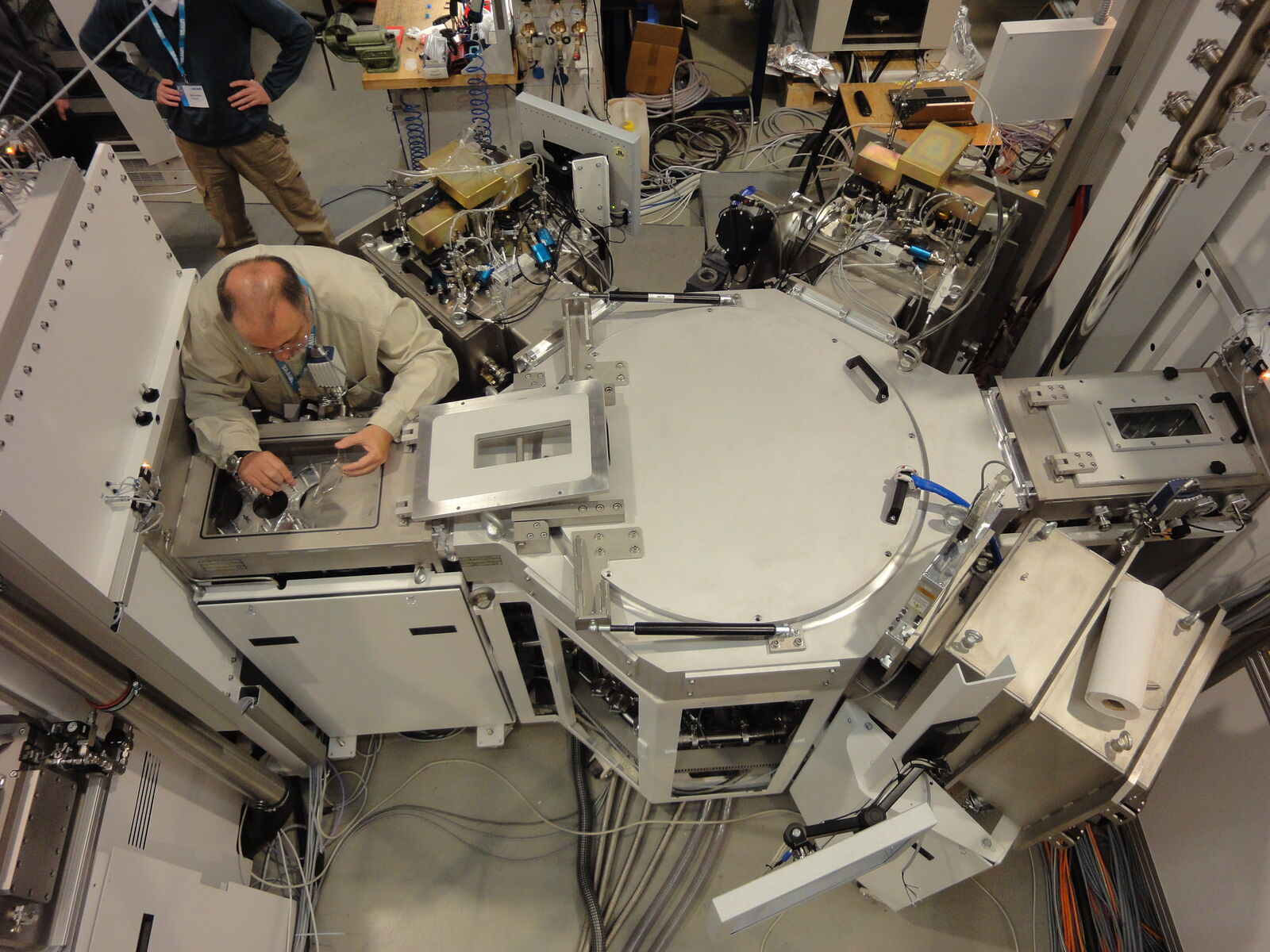 Engineers working on a cluster tool