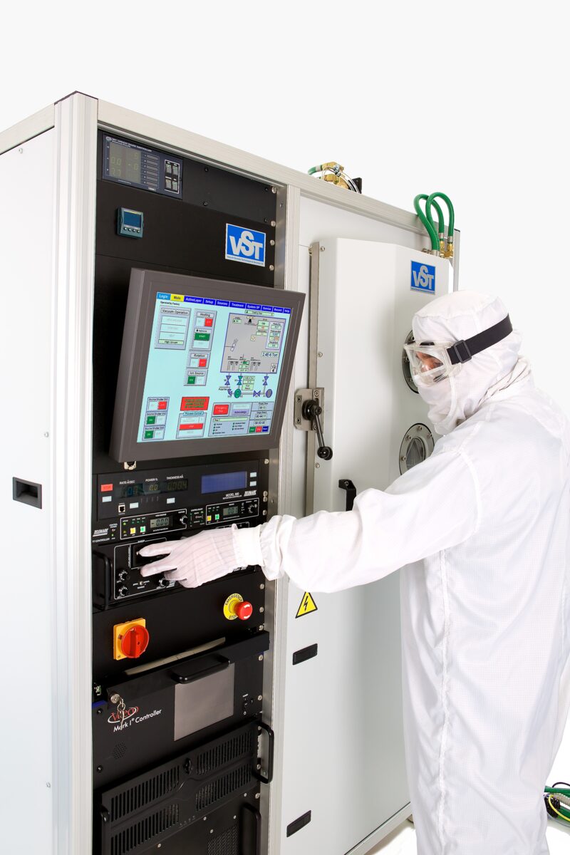 Operator at a deposition tool control panel